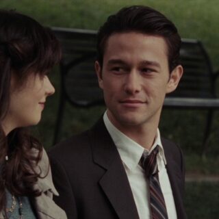 Jason Journal film scene of a man and woman sitting outdoors in park setting.