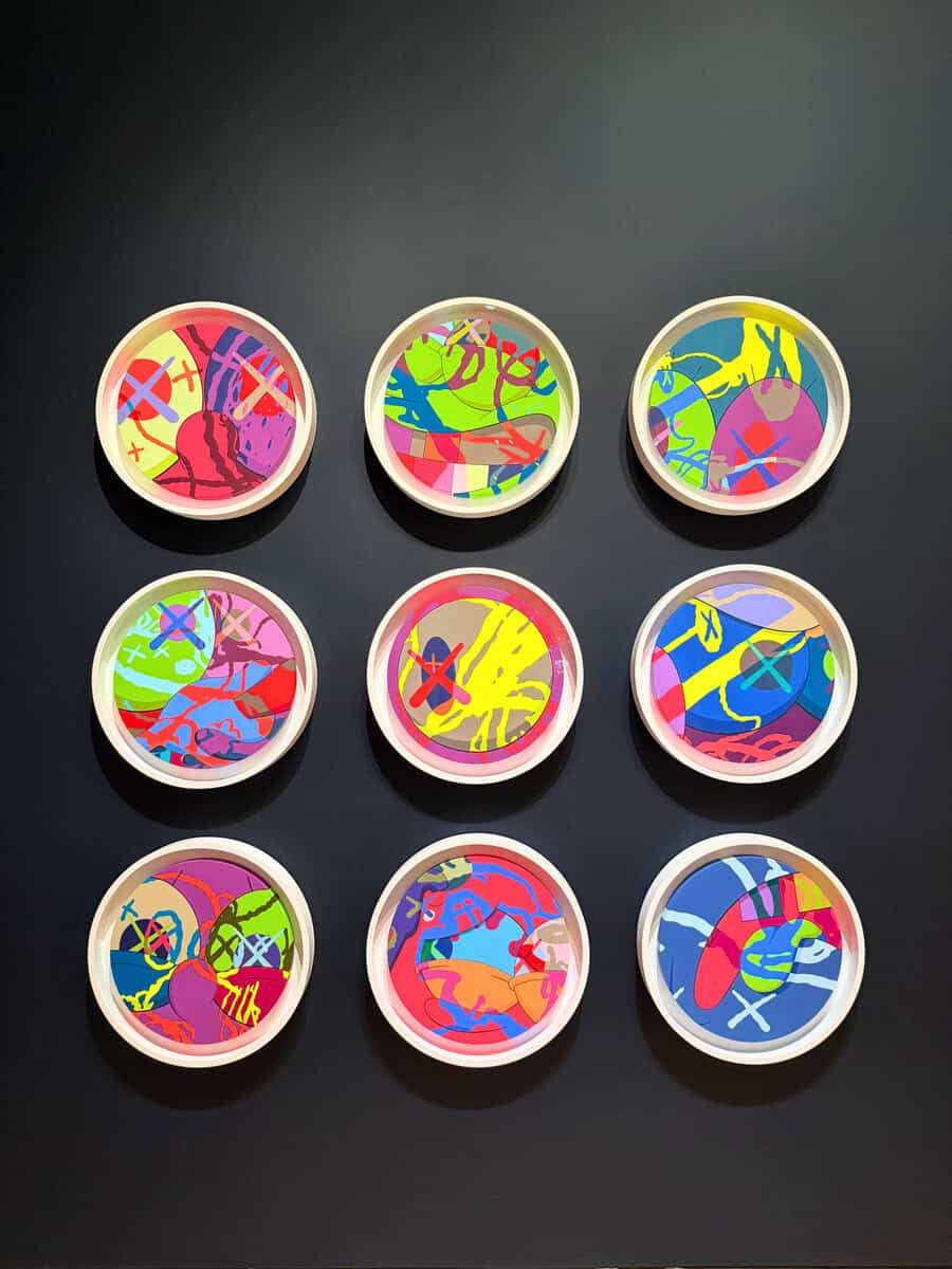 Bright, abstract circular artwork on display featuring vivid colors and bold designs for modern art enthusiasts.